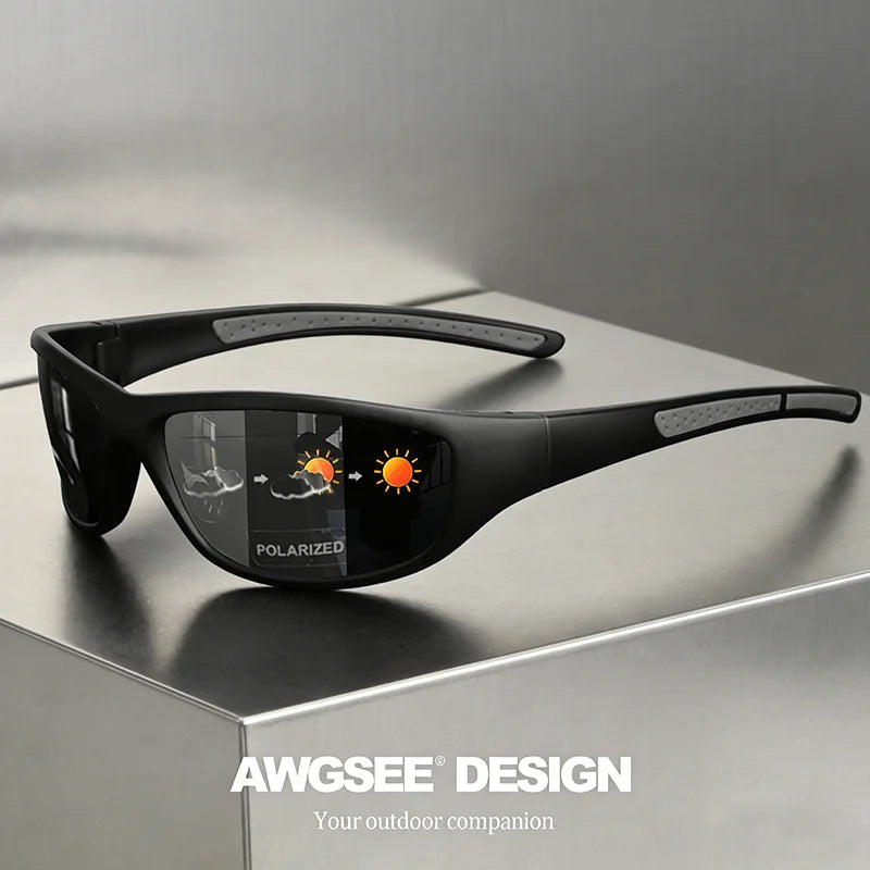 Black polarized sports sunglasses resting on a gray surface.
