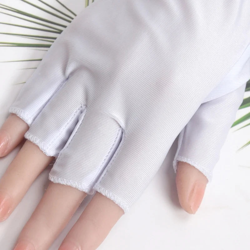 A close-up of a person's hand wearing white, ribbed thin stretch gloves.