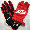 A pair of red and black durable motorcycle off-road riding gloves are displayed on a white surface.