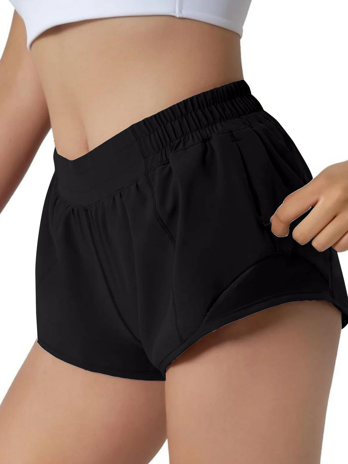 Black women's high-waisted running shorts worn by a model.