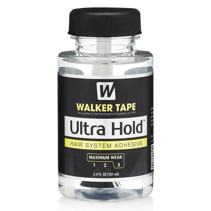 A bottle of Walker Tape Ultra Hold hair system adhesive with a black cap and clear liquid.