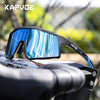 A pair of black sports sunglasses with blue polarized lenses resting on a black cycling handlebar.
