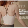 A woman wearing an elegant cross-strap sports bra for Pilates or yoga, highlighting its lightweight support and fit.