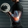 A person wearing a black shirt and an elbow support compression sleeve is lifting a dumbbell.