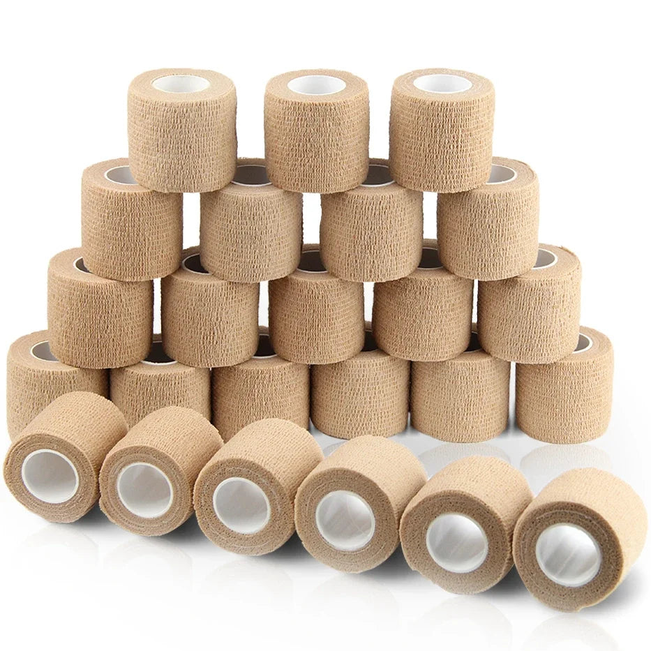 Rolls of beige self-adhesive sports bandages stacked and laid out for sale