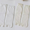 Pair of white knit crew socks with ruffle cuffs shown in a split image.