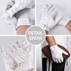 White professional sports training gloves with textured grip and impact protection features shown in detail.