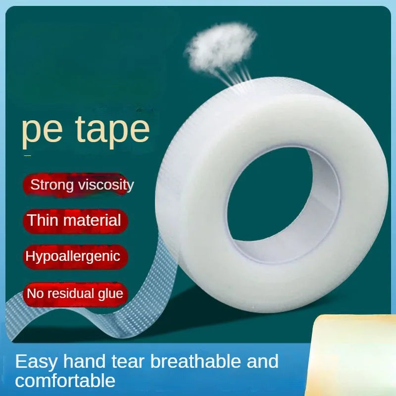 Roll of white PE tape with a puff of white material demonstrating its strong viscosity and thin, hypoallergenic properties.