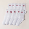 A row of twenty-three white men's classic crew socks displayed on a light background.