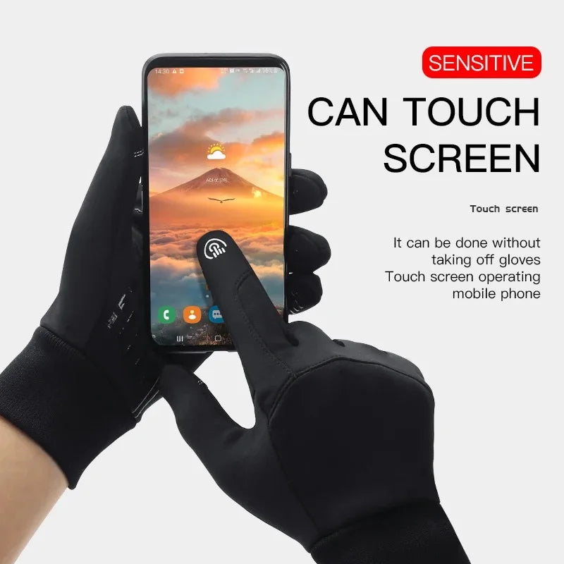 A hand wearing black gloves is touching the screen of a smartphone, demonstrating touch screen functionality.