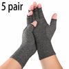 Five pairs of gray fingerless compression gloves being held on a hand.