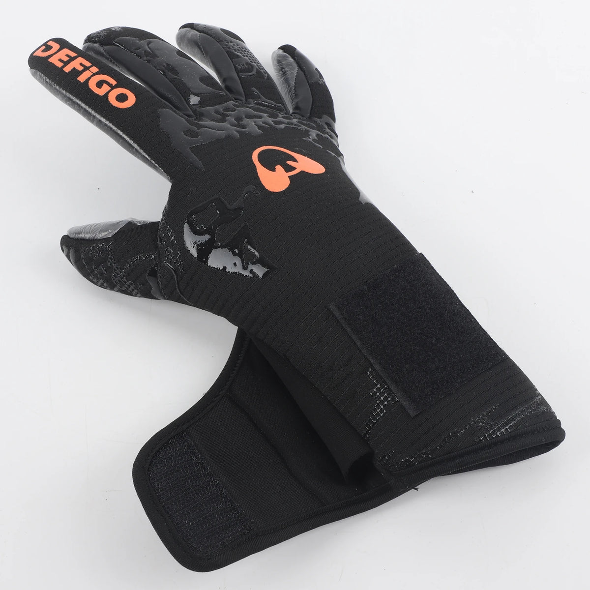 Black professional football goalkeeper gloves with orange branding and grip texture