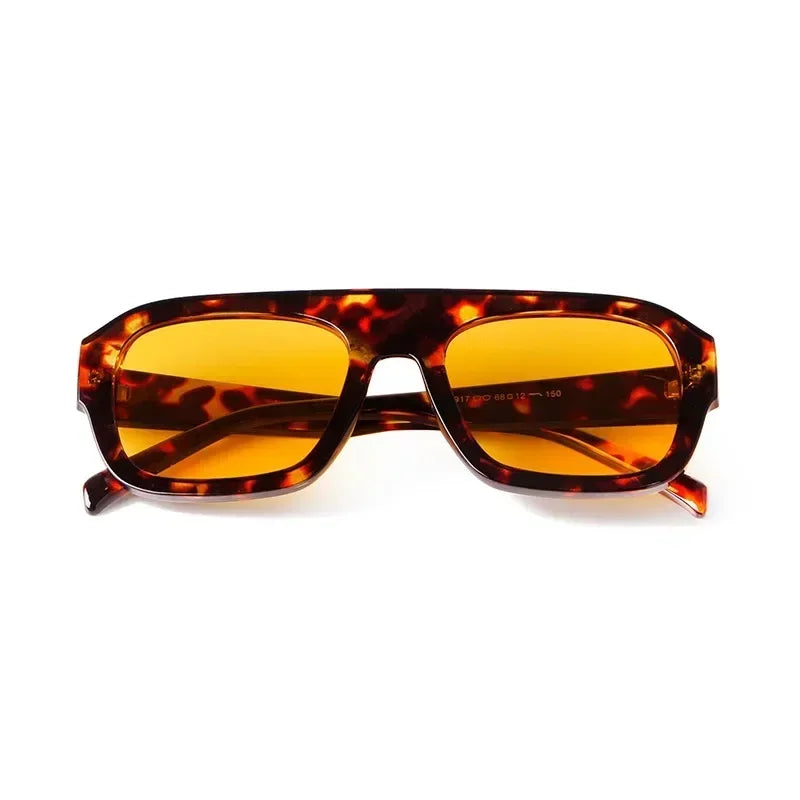 Vintage oversized square sunglasses with a tortoiseshell pattern lens frame.