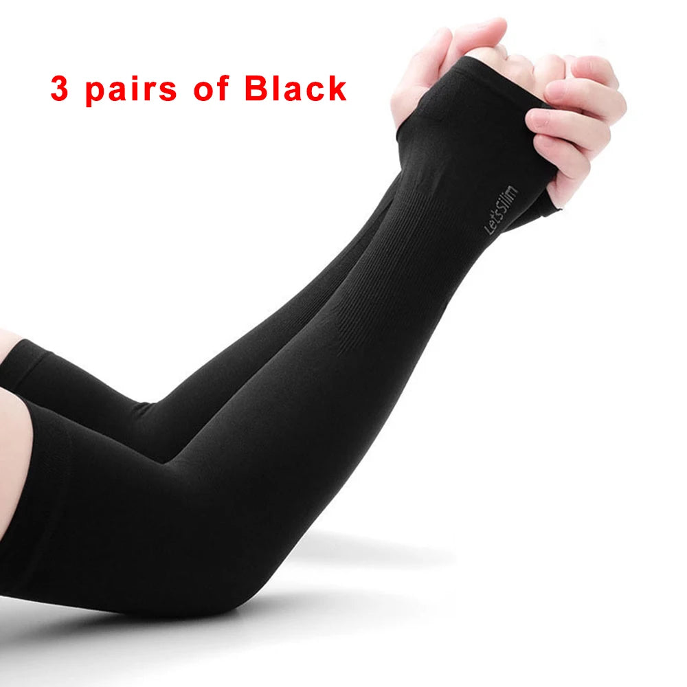 Three pairs of black protective arm sleeves being held by a person.