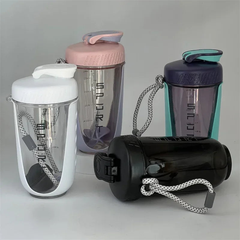 A set of three 600ml blender shaker bottles in various colors including white, purple, and blue/teal.