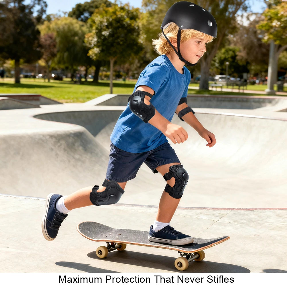 A young boy wearing a black helmet, knee pads, and elbow pads is riding a skateboard outdoors.
