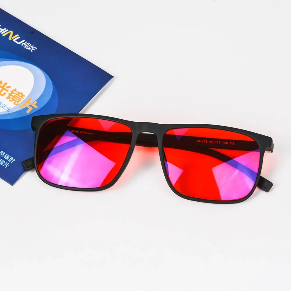 A pair of red-tinted blue light blocking sunglasses displayed on a white background.