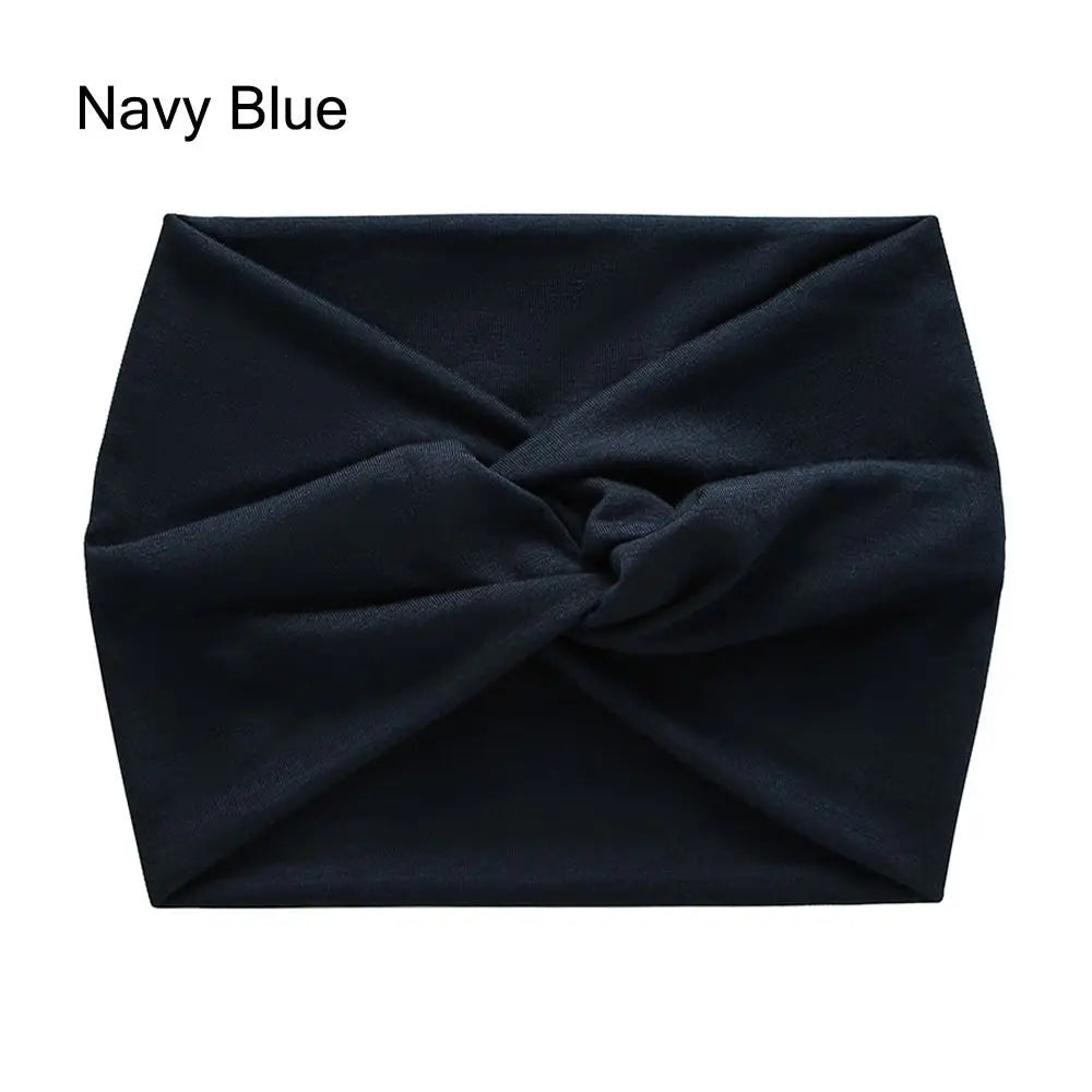 Navy blue cross-knotted fabric headband for yoga and workout