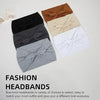 A collection of five solid colored bow knot headbands in brown, black, gray, beige, and white.