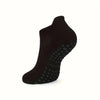 Black grip pilates socks for yoga and barre shown from the side