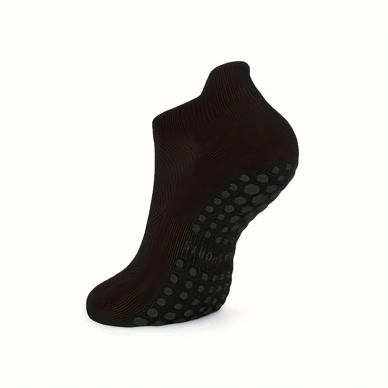 Black grip pilates socks for yoga and barre shown from the side