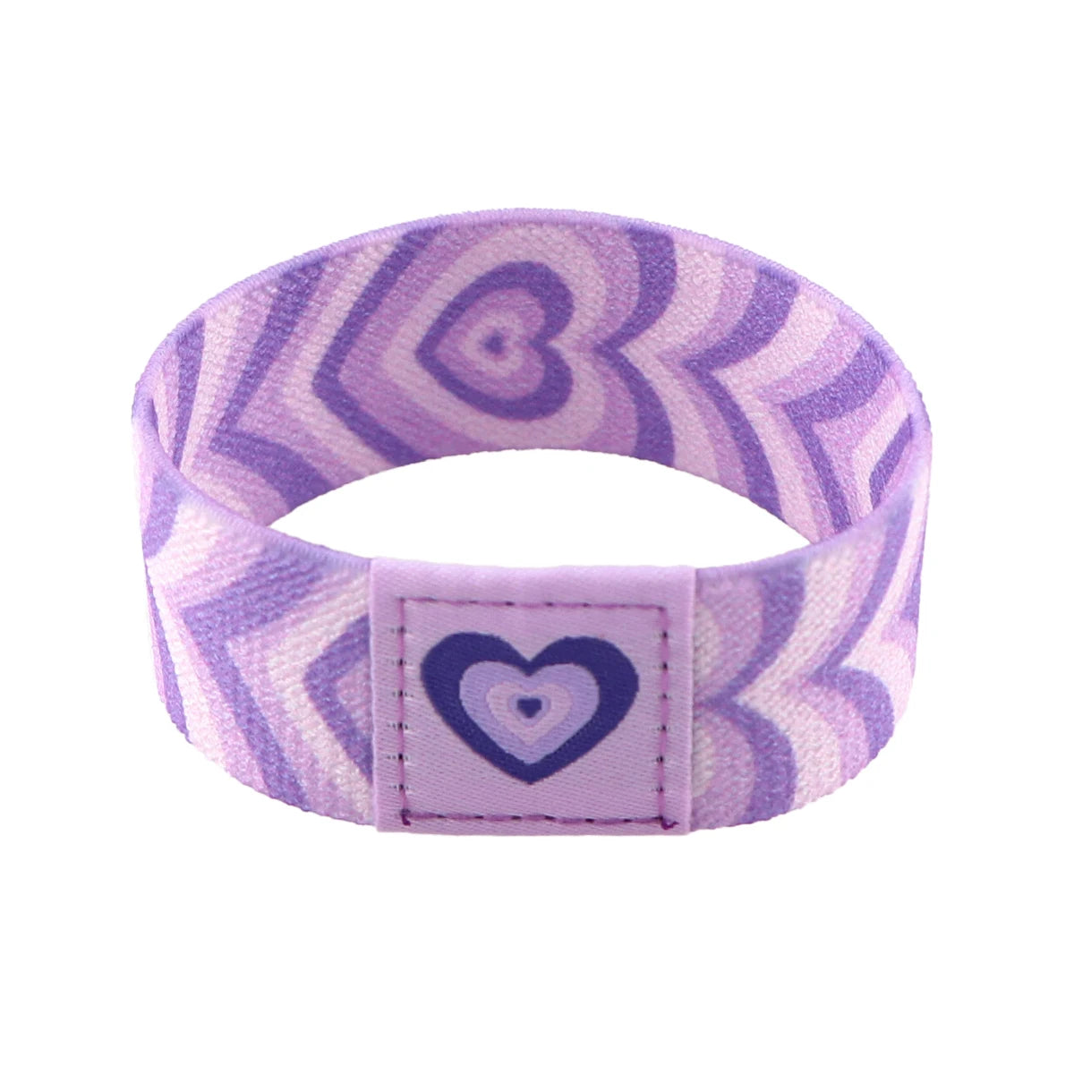 A purple and white patterned stretch wristband bracelet with a heart design detail.