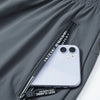 Gray jogger pants with a zippered pocket displaying an iPhone.