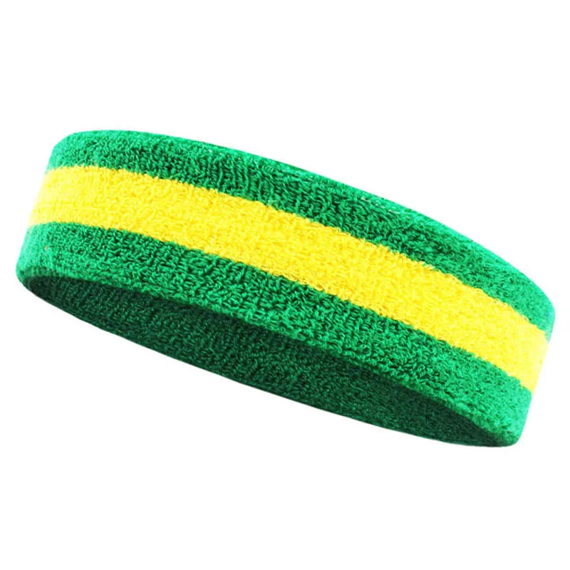 A green and yellow striped moisture-wicking athletic headband rolled into a cylinder.