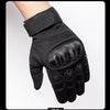 Black tactical full finger gloves worn on a hand, showing the grip and padded fingers.