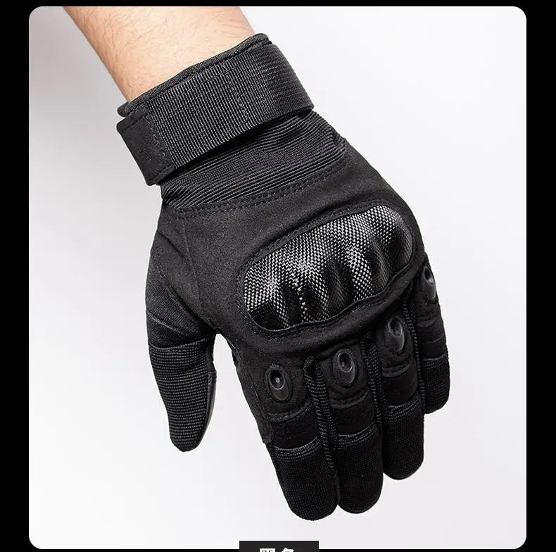 Black tactical full finger gloves worn on a hand, showing the grip and padded fingers.