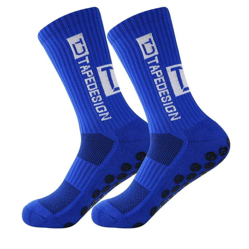 A pair of royal blue anti-slip performance sports socks with white text and black dots.