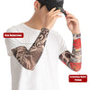 A person wearing a white t-shirt displays black and red UV protection arm sleeves with digital printing on their forearm.