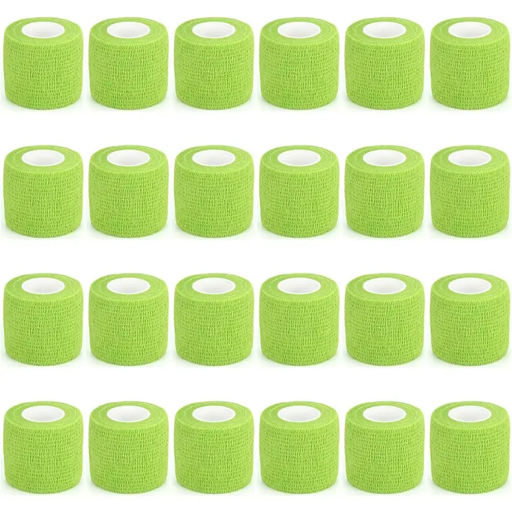 Rolls of green self-adhesive sports bandages for medical or athletic use