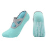 A pair of light teal silicone anti-slip pilates and yoga socks shown from the side.