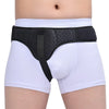 Black inguinal hernia support belt with compression pads worn over white underwear.