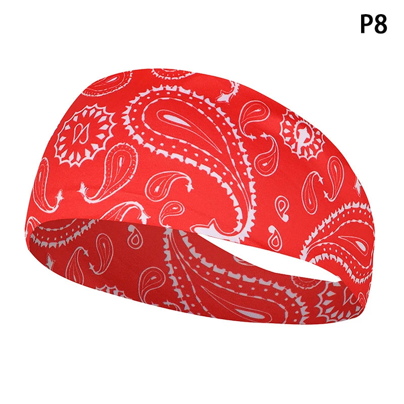 Red paisley patterned elastic sports headband shown from the side.