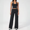 A woman wearing a black women's premium fitness tracksuit top and matching pants.