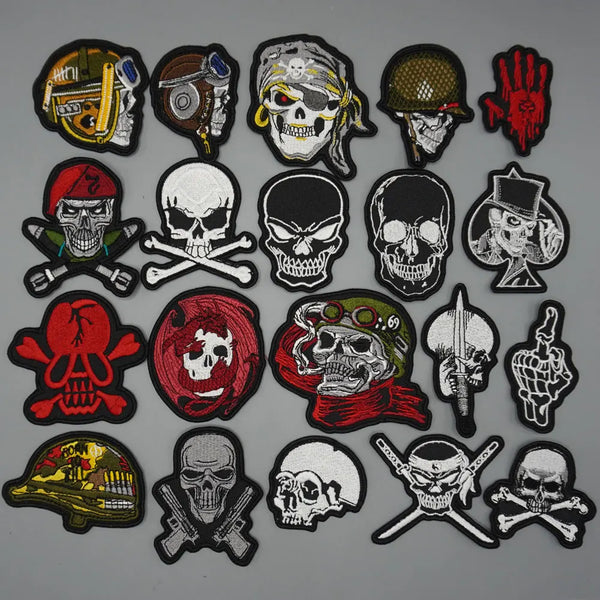 A collection of tactical embroidered skull patches in various designs and colors.