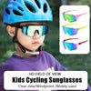 A child wearing a blue helmet holds a pair of colorful cycling sunglasses and various colored sports sunglasses.