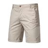 Light beige men's summer cotton casual shorts with a button closure and side pockets.
