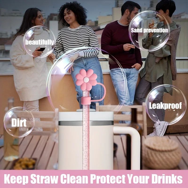 A set of six reusable straw covers and accessories for a Stanley tumbler are displayed in an outdoor setting.