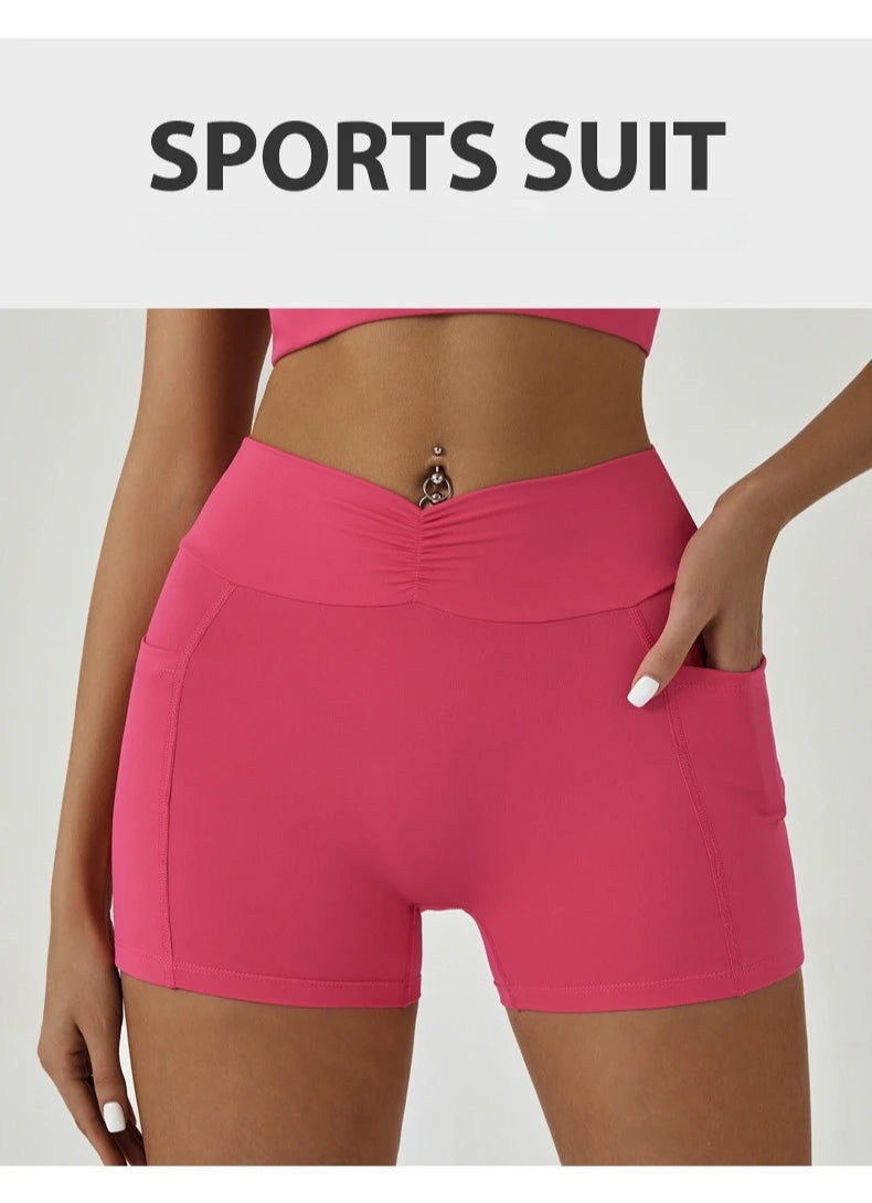 A model wearing a bright pink sports suit or high-waisted fitness leggings.