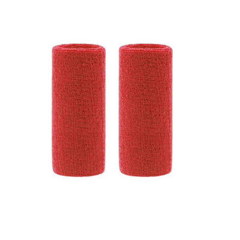 A pair of red dual sports wristbands designed for sweat absorption.