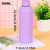 A purple 500ml insulated stainless steel thermos cup standing next to a white potted plant.
