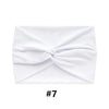 White fabric headband tied in a bow shape