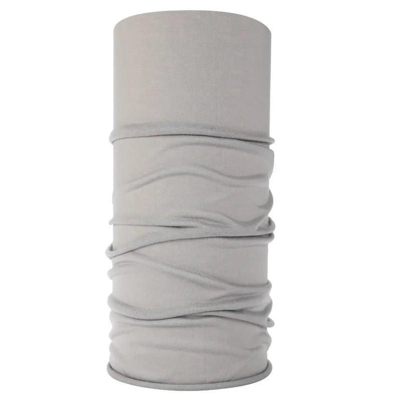 A cylindrical gray seamless fabric headband or balaclava rolled up.