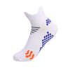 White running socks with blue dots and gray stripes featuring an orange detail.