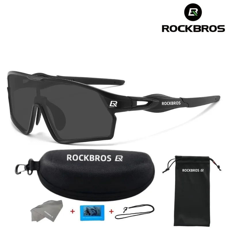 A pair of black polarized cycling sunglasses and a matching black storage pouch are shown.