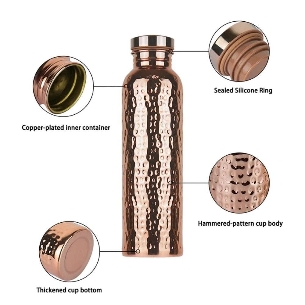 A copper-plated insulated water bottle with a hammered pattern body and sealed silicone ring.