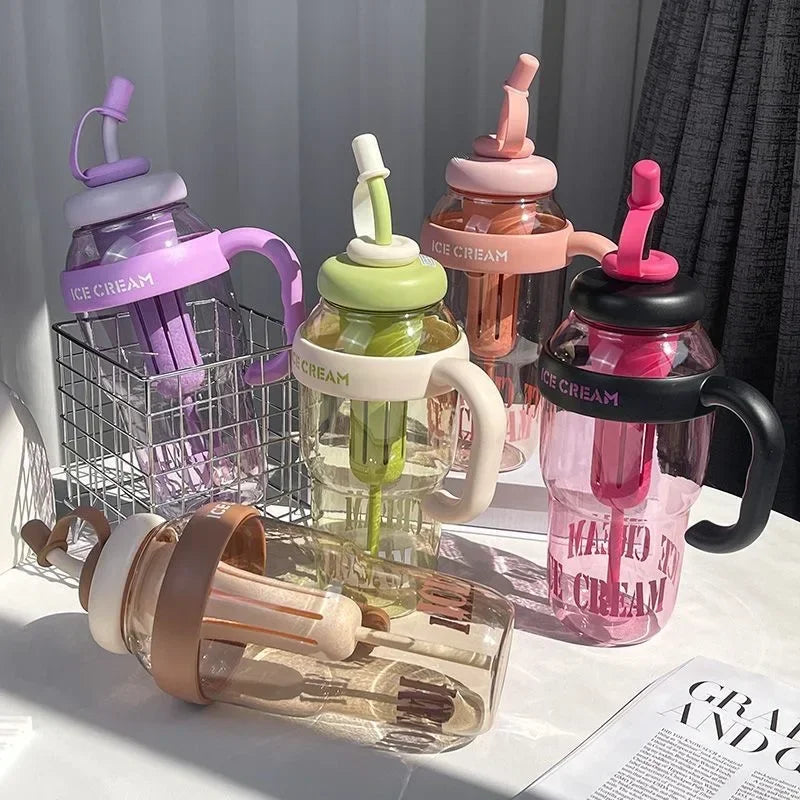 A collection of purple and pink plastic drinking cups and mugs for iced cream, including a large pitcher and smaller cups.